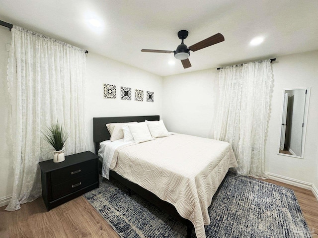 bedroom with wood finished floors, recessed lighting, and a ceiling fan