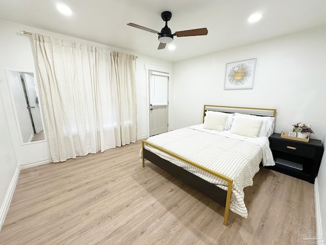 bedroom featuring recessed lighting, baseboards, ceiling fan, and wood finished floors