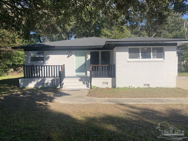 view of front of property with a porch and a front yard