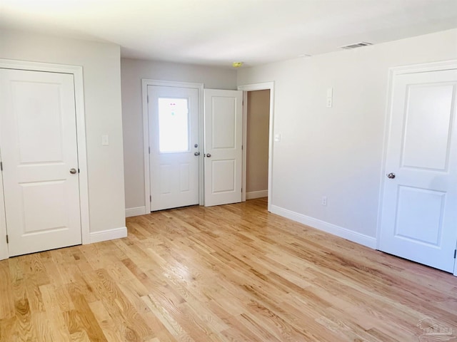 entrance foyer with light hardwood / wood-style floors