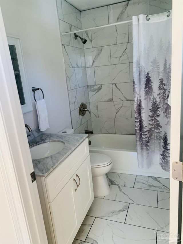 full bathroom featuring shower / bath combo, toilet, and vanity