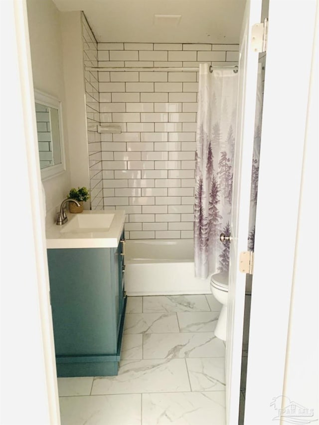 full bathroom featuring toilet, vanity, and shower / bath combination with curtain