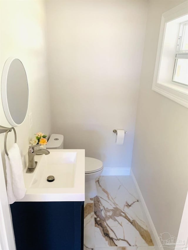 bathroom with toilet and vanity