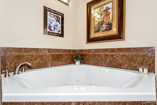 bathroom with a relaxing tiled tub