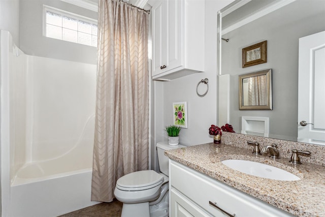 full bathroom featuring toilet, vanity, and shower / tub combo with curtain