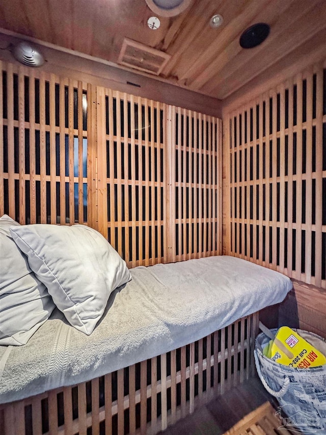 wine cellar featuring wooden ceiling