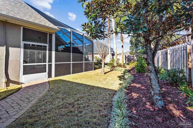 view of yard featuring a lanai