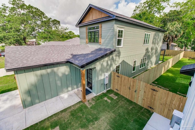 608 E Leonard Unit A & B, Pensacola, FL 32503 - back of property featuring a shingled roof and board and batten siding