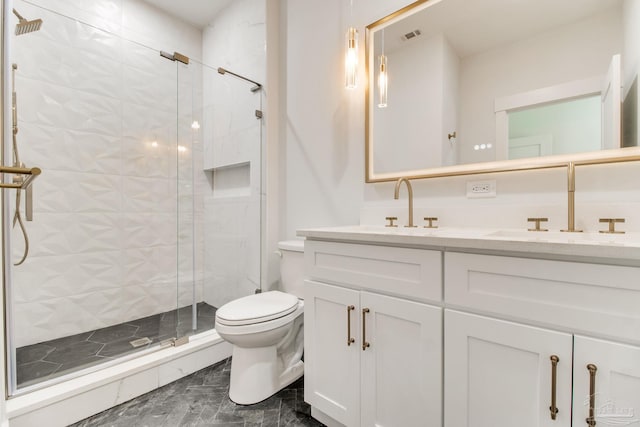 608 E Leonard Unit A & B, Pensacola, FL 32503 - bathroom featuring a shower stall, toilet, double vanity, and marble look tile flooring