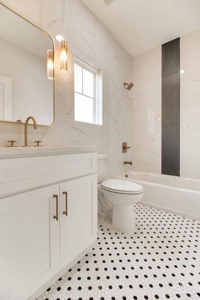 608 E Leonard Unit A & B, Pensacola, FL 32503 - bathroom with toilet, shower / bath combination, vanity, and tile walls