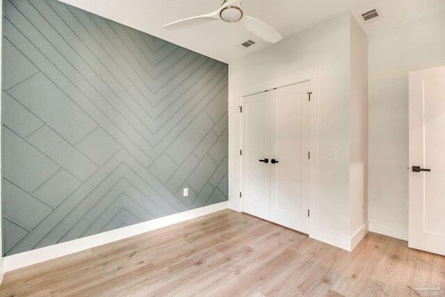 608 E Leonard Unit A & B, Pensacola, FL 32503 - unfurnished bedroom with light wood-type flooring, baseboards, a closet, and a ceiling fan
