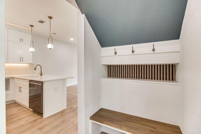 608 E Leonard Unit A & B, Pensacola, FL 32503 - kitchen featuring stainless steel dishwasher, a sink, white cabinets, light wood-style floors, and recessed lighting