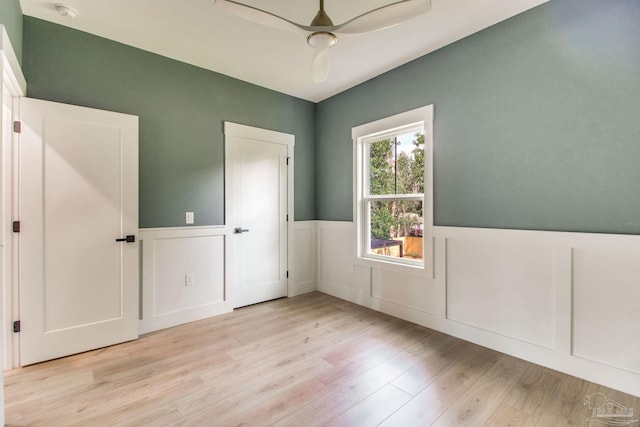 608 E Leonard Unit A & B, Pensacola, FL 32503 - empty room featuring wainscoting, light wood-type flooring, ceiling fan, and a smoke detector