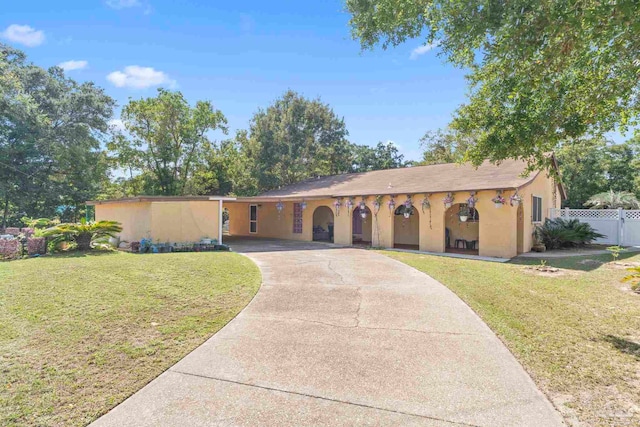 ranch-style home with a front lawn