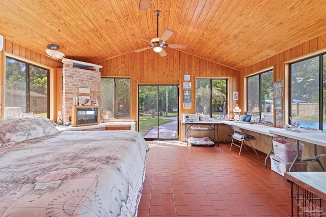 bedroom with multiple windows, wooden walls, and wooden ceiling