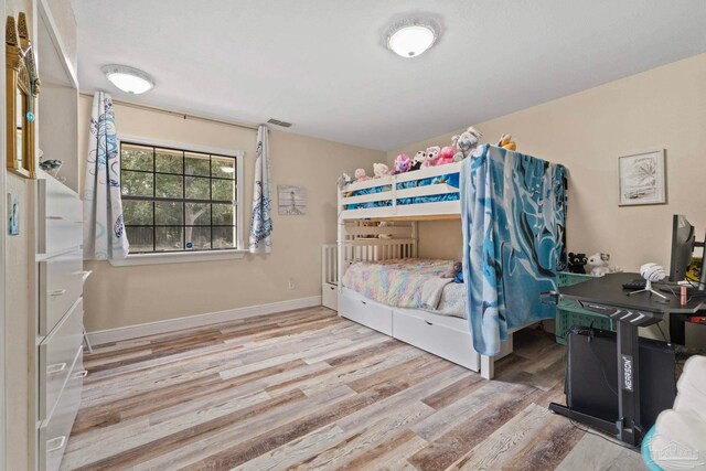 bedroom with light hardwood / wood-style floors