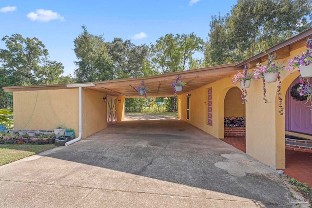 view of car parking featuring a carport