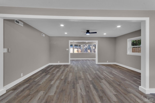 unfurnished living room featuring ceiling fan, hardwood / wood-style floors, and a healthy amount of sunlight