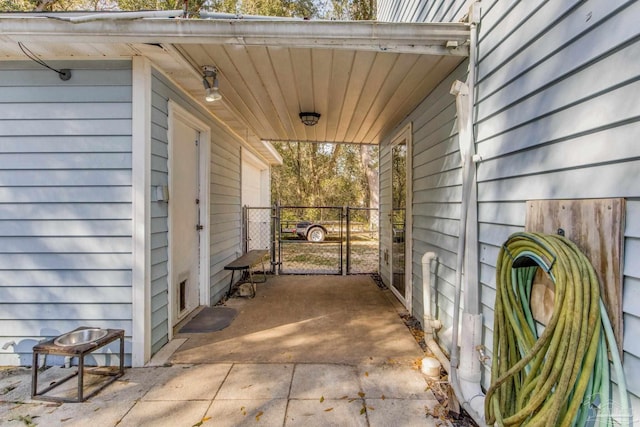 view of patio with a gate and an attached carport