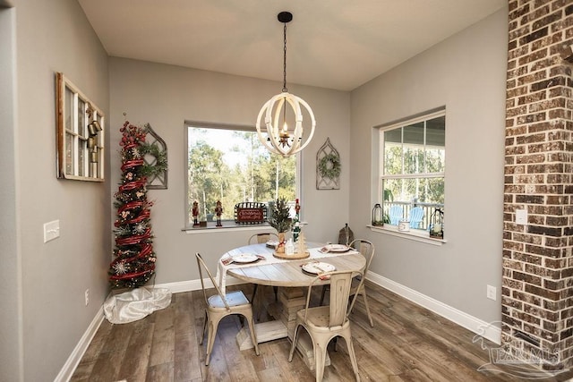 dining space featuring a chandelier and wood-type flooring