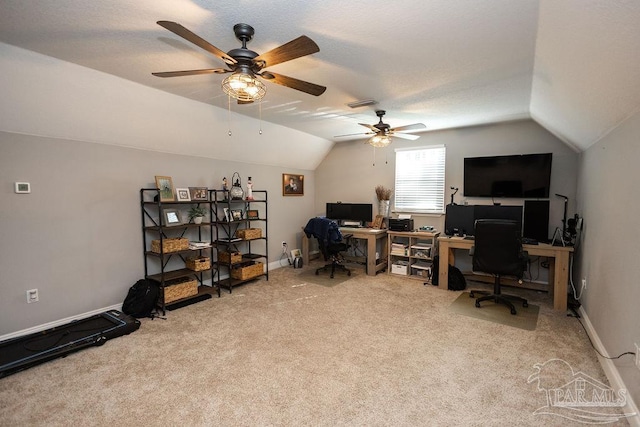 carpeted office featuring ceiling fan and vaulted ceiling