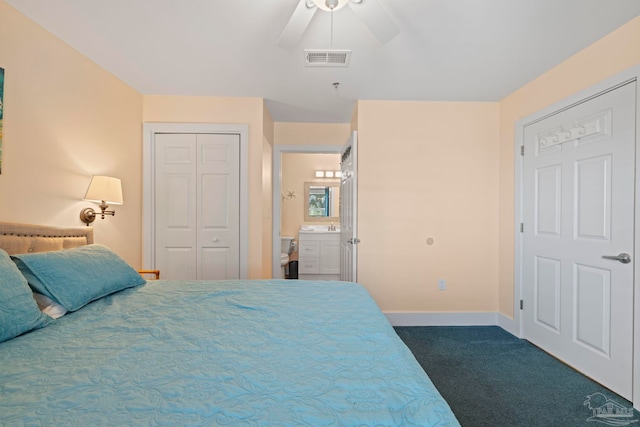 carpeted bedroom with connected bathroom and ceiling fan