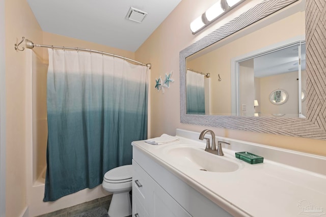 full bathroom with tile patterned flooring, vanity, shower / tub combo, and toilet