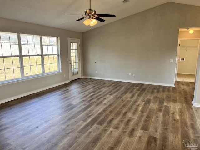 empty room featuring ceiling fan, lofted ceiling, and dark hardwood / wood-style flooring