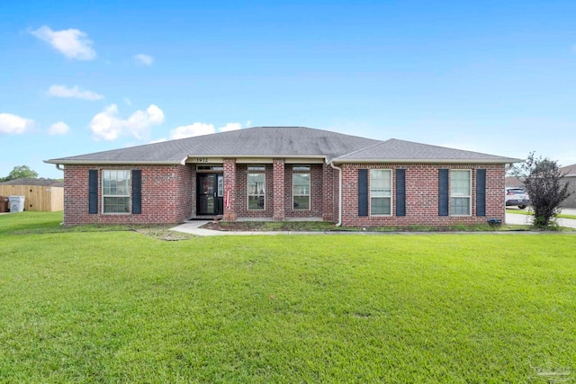 3972 Flour Mill Cir, Pace, FL 32571 - ranch-style house featuring a front yard, brick siding, and a shingled roof