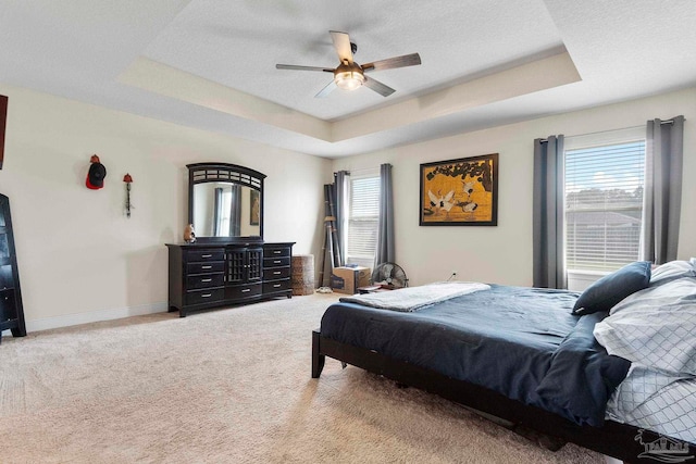 3972 Flour Mill Cir, Pace, FL 32571 - carpeted bedroom featuring a raised ceiling, ceiling fan, and baseboards