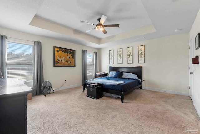 3972 Flour Mill Cir, Pace, FL 32571 - carpeted bedroom featuring a raised ceiling, baseboards, and a ceiling fan