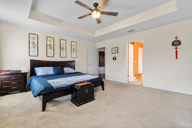 3972 Flour Mill Cir, Pace, FL 32571 - bedroom featuring a tray ceiling, light colored carpet, baseboards, and ensuite bathroom