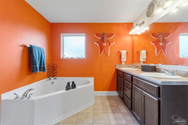 3972 Flour Mill Cir, Pace, FL 32571 - full bathroom featuring double vanity, a garden tub, tile patterned floors, and baseboards