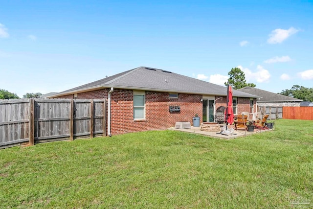 3972 Flour Mill Cir, Pace, FL 32571 - back of house featuring brick siding, a patio area, and roof with shingles