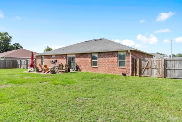 3972 Flour Mill Cir, Pace, FL 32571 - back of house with brick siding and a gate