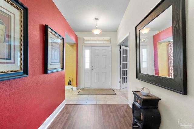 3972 Flour Mill Cir, Pace, FL 32571 - foyer entrance with baseboards and wood finished floors
