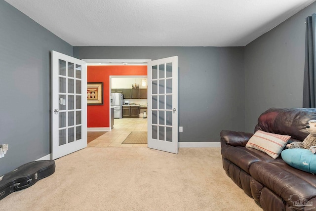 3972 Flour Mill Cir, Pace, FL 32571 - sitting room featuring french doors, light carpet, and baseboards