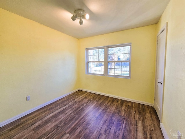 unfurnished room featuring dark hardwood / wood-style floors