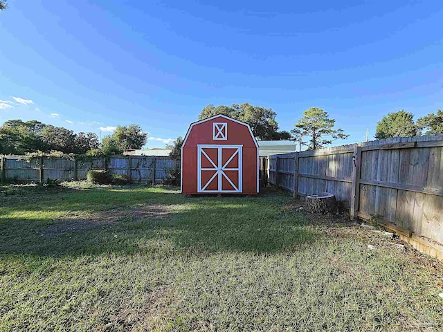 view of outbuilding with a yard