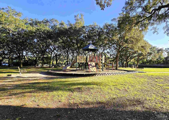 view of playground with a lawn