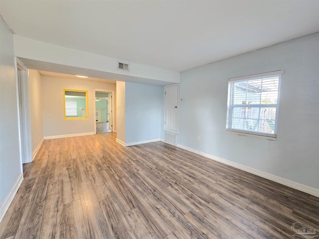 empty room featuring wood-type flooring