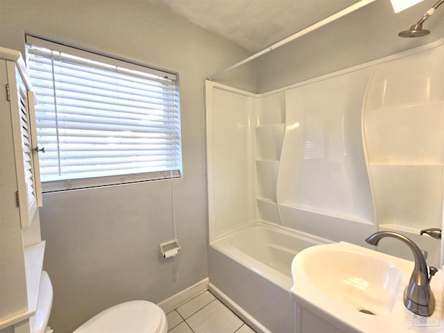 full bathroom with tile patterned floors, toilet, sink, and shower / washtub combination