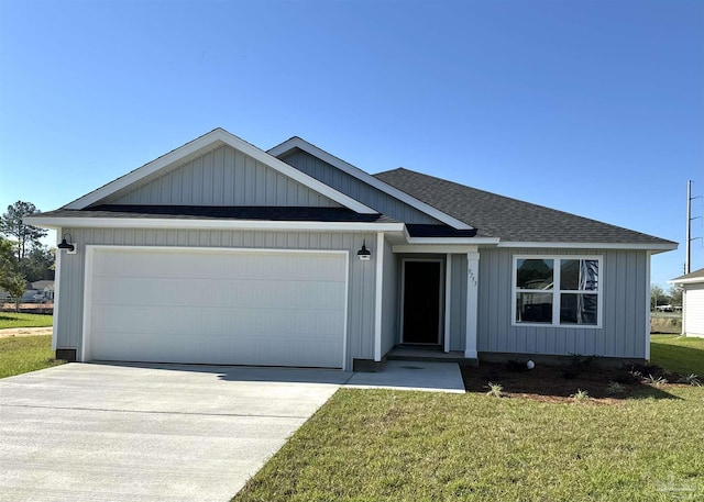 view of front of home featuring a garage and a front yard