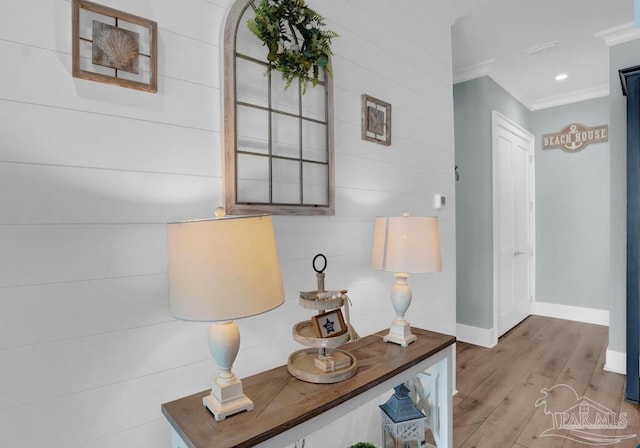 1592 W Beach Blvd Unit Kk, Gulf Shores, AL 36542 - hallway featuring wood finished floors, ornamental molding, and baseboards