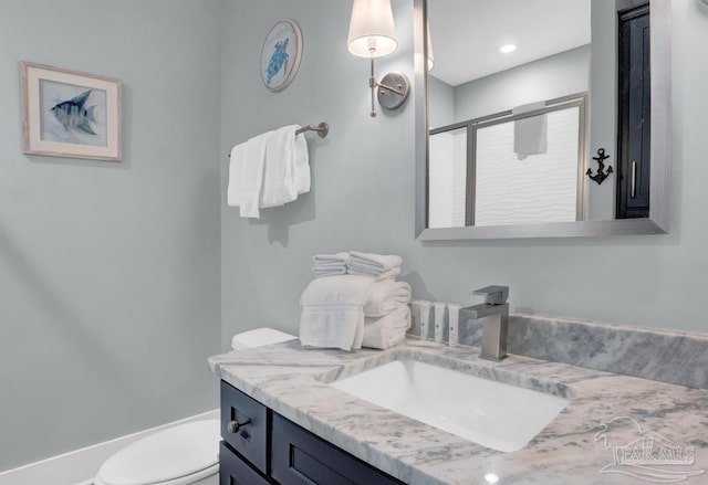 1592 W Beach Blvd Unit Kk, Gulf Shores, AL 36542 - bathroom featuring vanity, toilet, and a shower stall