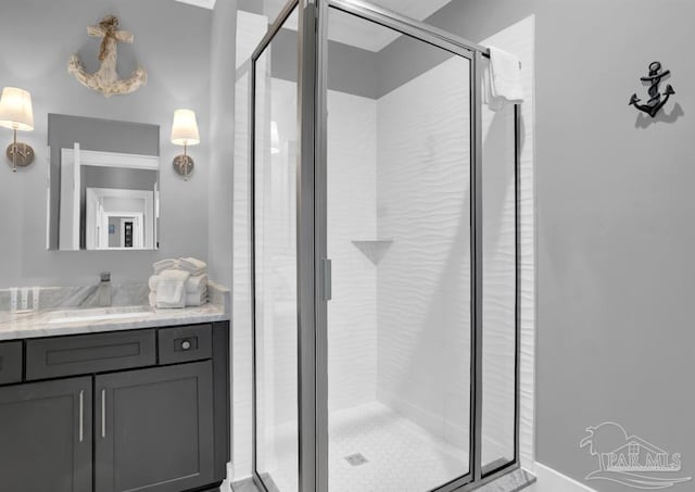 1592 W Beach Blvd Unit Kk, Gulf Shores, AL 36542 - bathroom featuring vanity and a shower stall