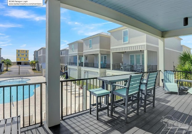 1592 W Beach Blvd Unit Kk, Gulf Shores, AL 36542 - deck featuring a community pool and a residential view