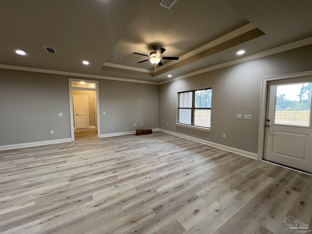 6607 Rocky Shores Rd, Milton, FL 32583 - spare room featuring a tray ceiling, ornamental molding, a ceiling fan, light wood finished floors, and recessed lighting