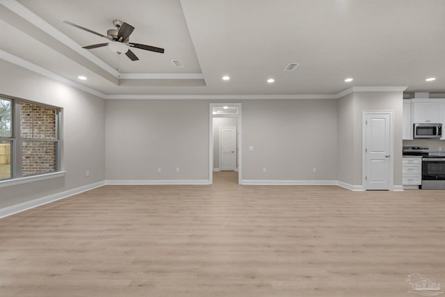 6607 Rocky Shores Rd, Milton, FL 32583 - unfurnished living room with light wood finished floors, ornamental molding, recessed lighting, a ceiling fan, and a raised ceiling