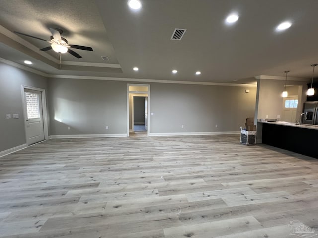 6607 Rocky Shores Rd, Milton, FL 32583 - unfurnished living room with crown molding, light wood-type flooring, ceiling fan, healthy amount of natural light, and recessed lighting